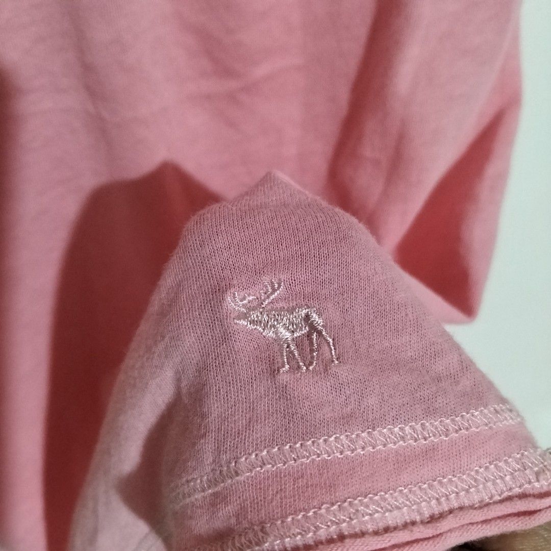 Abercrombie baby doll Top S (Category: Sleeveless) located in Subic. Submitted by tintindera (Listing ID 1438431291, Image 3). Description: - Abercrombie & Fitch tank top - Pink color - Criss-cross back design - Lace detail on neckline - Embroidered logo - Size: S - Made in Macau.