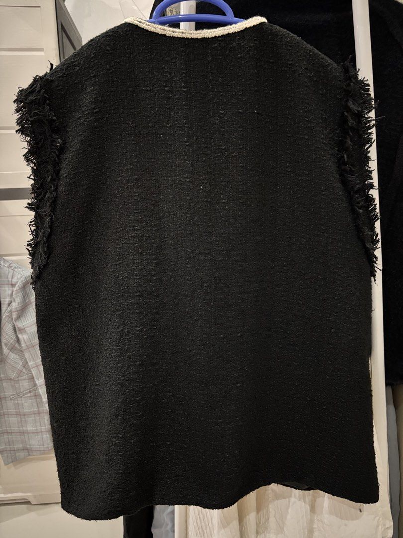 Ace Stage Tweed Vest (Category: Sleeveless) located in Los Banos. Submitted by _loopee27 (Listing ID 1438350380, Image 3). Description: - Ace Stage black tweed vest - Round neckline - Four front pockets with white trim - Fringe detail on shoulders - Pearl-like buttons - Plain black tweed back - Fit to Small to Medium .
