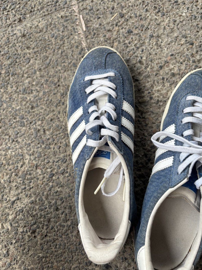 Adidas Gazelle Blue Sneakers (Category: Sneakers) located in Pasig City. Submitted by bcp1122 (Listing ID 1438325497, Image 3). Description: - Adidas Gazelle sneakers Can fit up to 23 cm Very negotiable - Color: Blue with white stripes - Features white laces and sole - Adidas logo visible - Signs of wear on soles - Stylish for everyday wear - issues: old From seller who gets from US RFS: don't use.