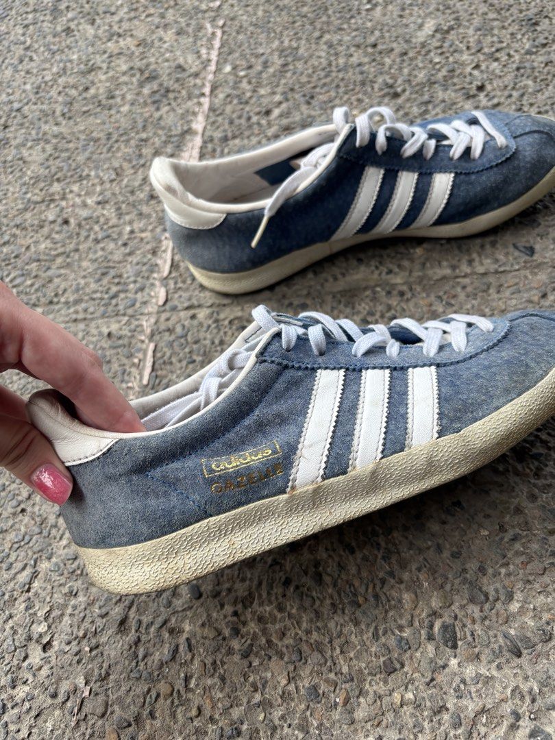 Adidas Gazelle Blue Sneakers (Category: Sneakers) located in Pasig City. Submitted by bcp1122 (Listing ID 1438325497, Image 2). Description: - Adidas Gazelle sneakers Can fit up to 23 cm Very negotiable - Color: Blue with white stripes - Features white laces and sole - Adidas logo visible - Signs of wear on soles - Stylish for everyday wear - issues: old From seller who gets from US RFS: don't use.