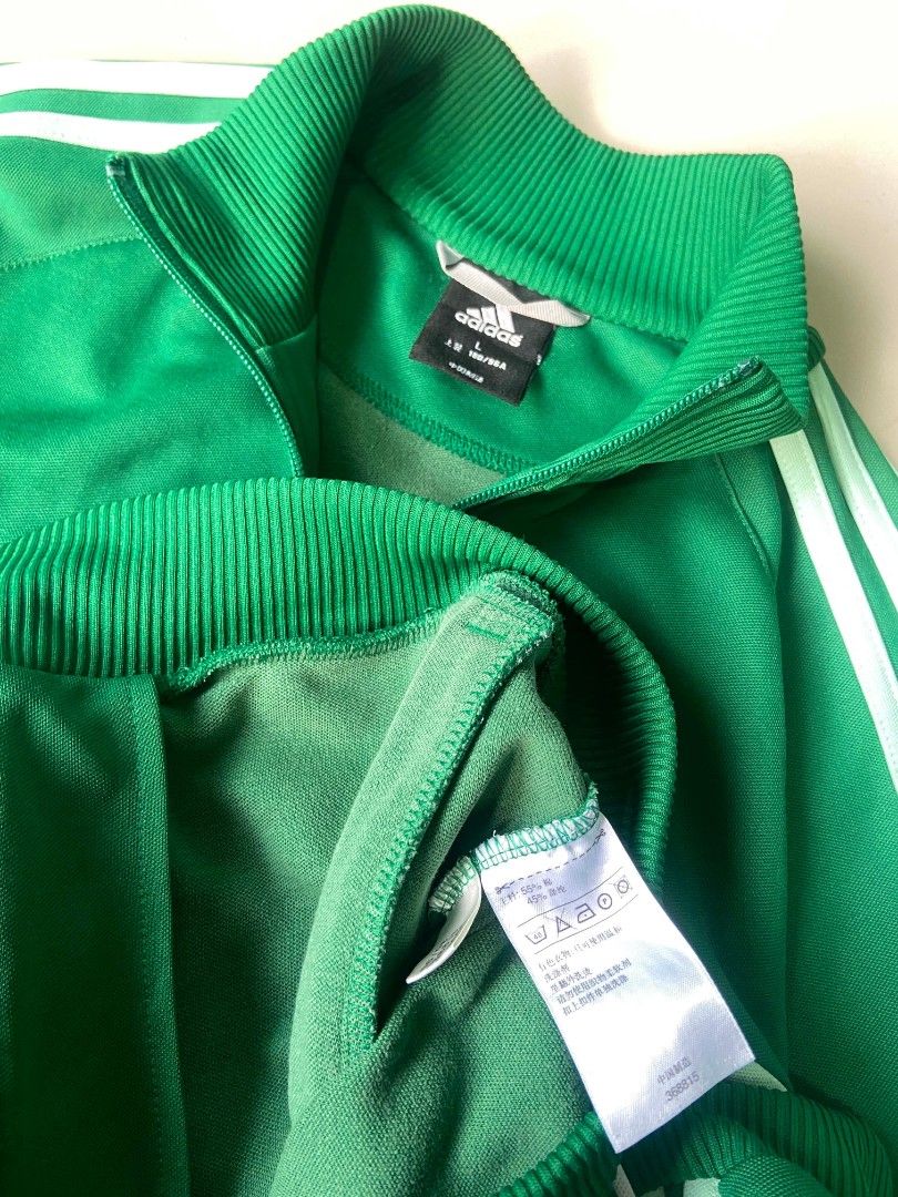 Adidas Green Track Jacket (Category: Coats, Jackets and Outerwear) located in Silang. Submitted by thriftsab_ph (Listing ID 1438436682, Image 3). Description: - Issue: repaired loose stitch on ribbings -22x27 dimes -Adidas track jacket - Green with white stripes - Full zip closure - Stand-up collar - Color block design - Adidas logo on chest - Size L.