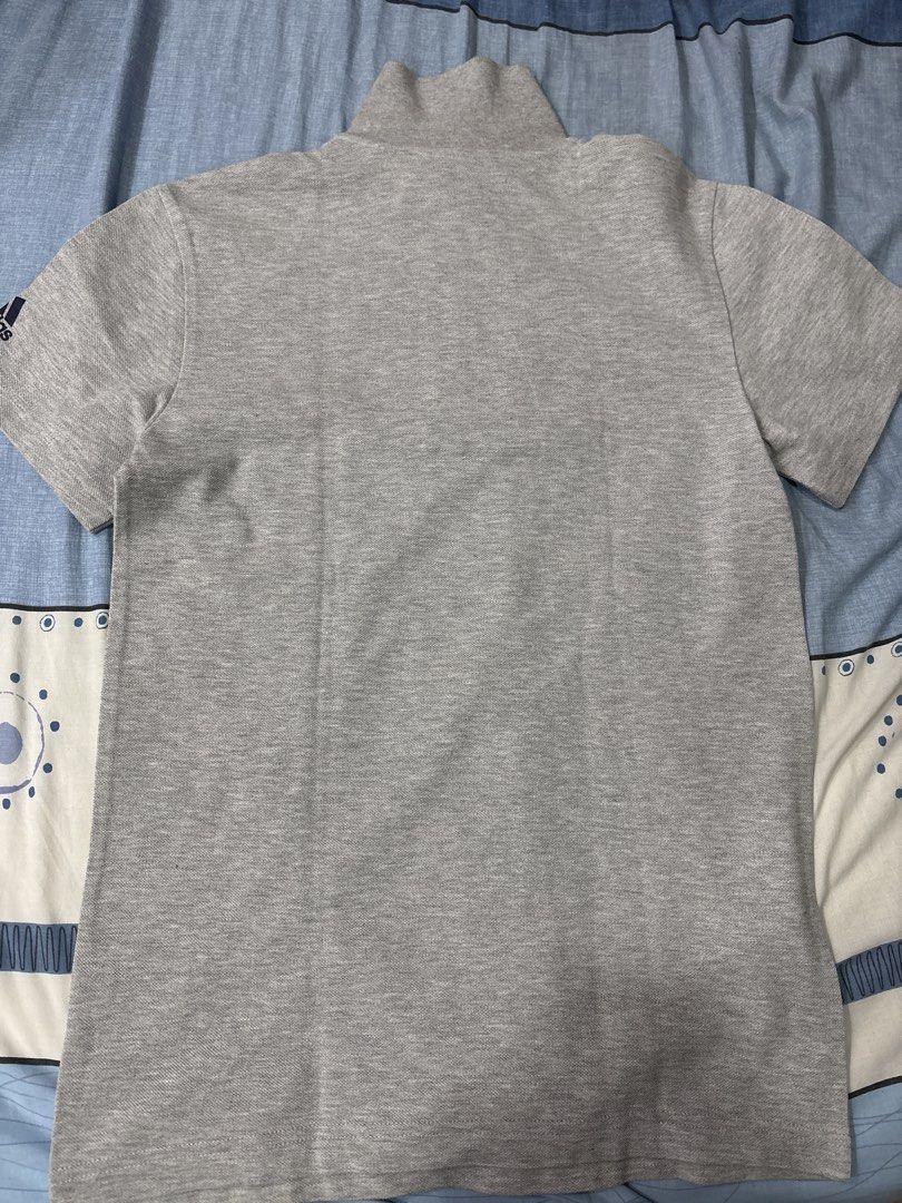 Adidas Polo Shirt XS (Category: Tshirts & Polo Shirts ) located in Manila. Submitted by colin92421 (Listing ID 1438371076, Image 2). Description: - Adidas grey polo shirt - Size: XS - Features a mock neck collar - Three-button placket - Short sleeves - Adidas logo on chest and sleeve - Made in Turkey.