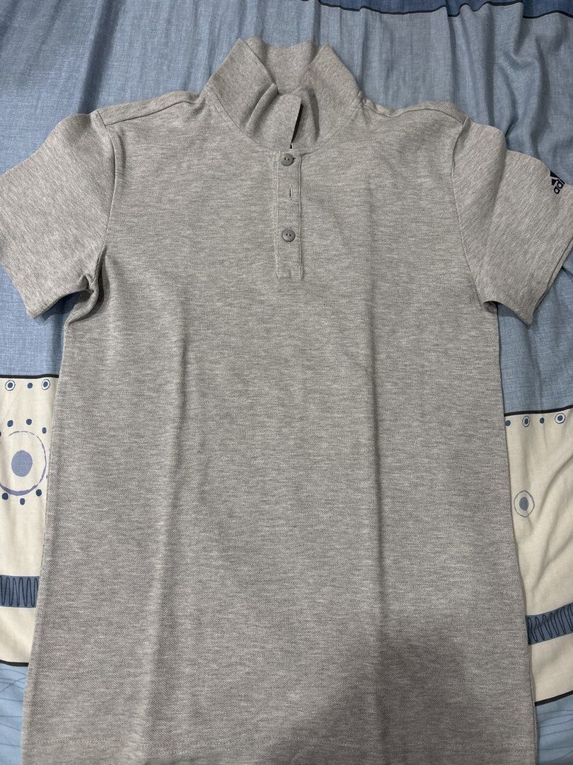 Adidas Polo Shirt XS (Category: Tshirts & Polo Shirts ) located in Manila. Submitted by colin92421 (Listing ID 1438371076, Image 1). Description: - Adidas grey polo shirt - Size: XS - Features a mock neck collar - Three-button placket - Short sleeves - Adidas logo on chest and sleeve - Made in Turkey.