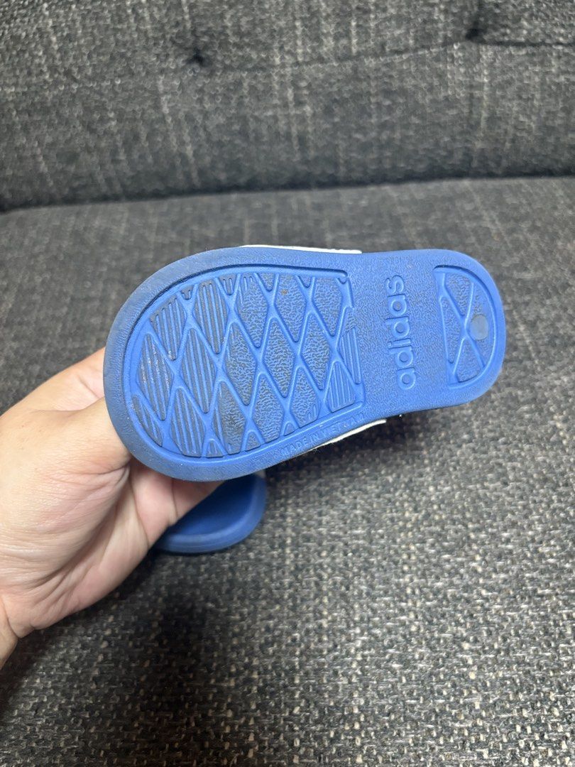 Adidas Toddler Sandals Blue White (Category: Babies & Kids Fashion) located in Mabalacat. Submitted by fhey.09 (Listing ID 1438419981, Image 2). Description: - Adidas toddler sandals - Color: Blue and white - Size: 4K - Features: Back strap for security - Made in Vietnam - Condition: Some wear on soles.