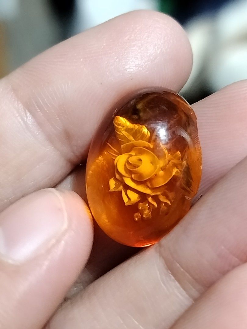 Amber Pendant with Rose Carving (Category: Necklaces) located in Tacloban City. Submitted by jsthrift002591 (Listing ID 1438494106, Image 3). Description: - Amber pendant with rose carving 20mm - Warm, orange-brown color - Smooth, polished surface - Intricately detailed rose carving - Unique and elegant jewelry piece.