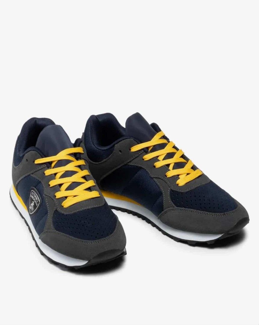 Automobili Lamborghini Sneakers (Category: Sneakers) located in Manila. Submitted by kiksfoekd (Listing ID 1438355182, Image 3). Description: - Automobili Lamborghini sneakers - Color scheme: Navy, grey, and yellow - Lamborghini logo on the side - Yellow laces - Black sole with white midsole - Combination of mesh and suede-like materials.