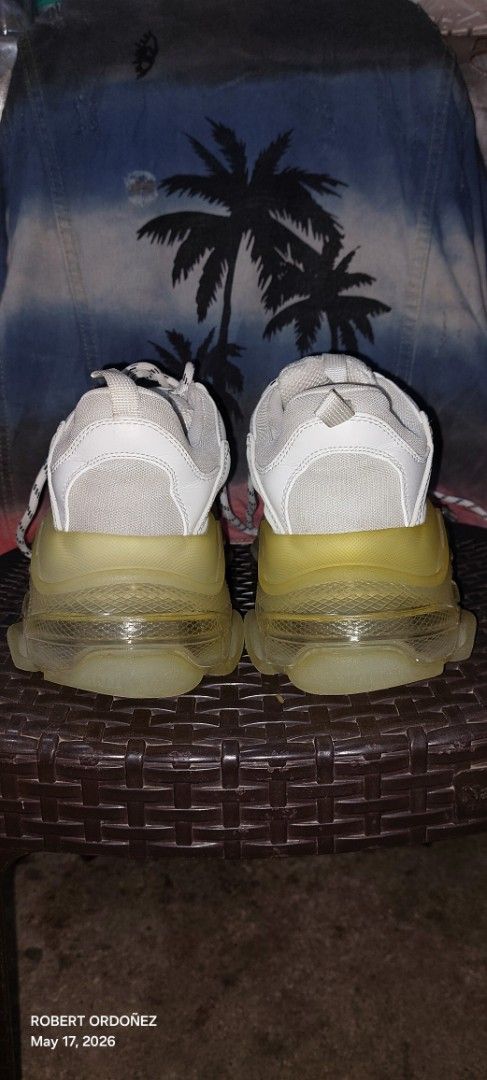 Balenciaga Triple S Sneakers White (Category: Sneakers) located in Candelaria. Submitted by RHOBZ29 (Listing ID 1438472077, Image 3). Description: - Balenciaga Triple S sneakers - Color: White - Size: 41 - Chunky sole design - Balenciaga logo detail - Mesh upper - Translucent yellow soles - White laces - Made in China.