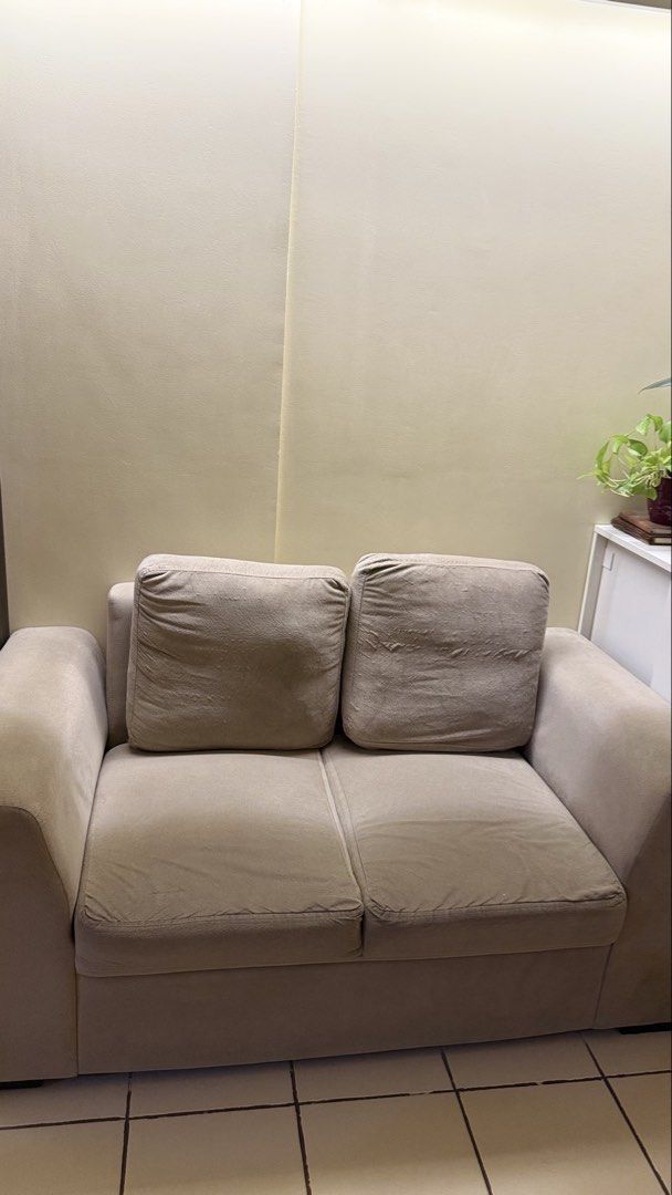 Beige 2-Seater Sofa (Category: Sofas) located in Manila. Submitted by ishiki.mnld (Listing ID 1438473070, Image 1). Description: - Beige 2-seater sofa - Includes two removable cushions - Comfortable design - Soft, textured fabric - Neutral color, easy to match - Ideal for living rooms and small spaces Issue - sira na po yung zipper nung 2 backpillow. Pero di naman halata pag nakabaligtad..