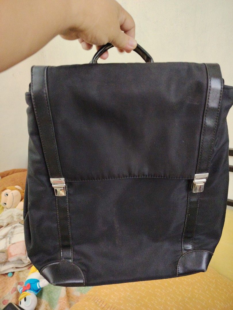 Black Backpack with Silver Hardware (Category: Backpacks) located in Taguig. Submitted by roxie0419 (Listing ID 1438499429, Image 2). Description: - Black backpack - Flap closure with silver hardware - Top handle - Adjustable shoulder straps - Zippered back pocket - Nylon-like material with leather accents SF c/o buyer MOP GCash or Maya COP via LBC.