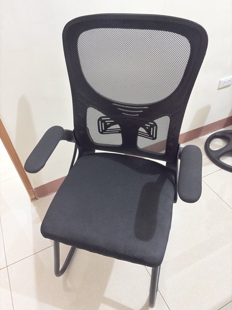 Black Mesh Office Chair with Armrests (Category: Chairs) located in Manila. Submitted by declutterbyshy (Listing ID 1438475080, Image 1). Description: - Breathable mesh back for comfort - Padded seat - Includes armrests - Sturdy frame - Ideal for home or office - Suitable for long hours of work or study.