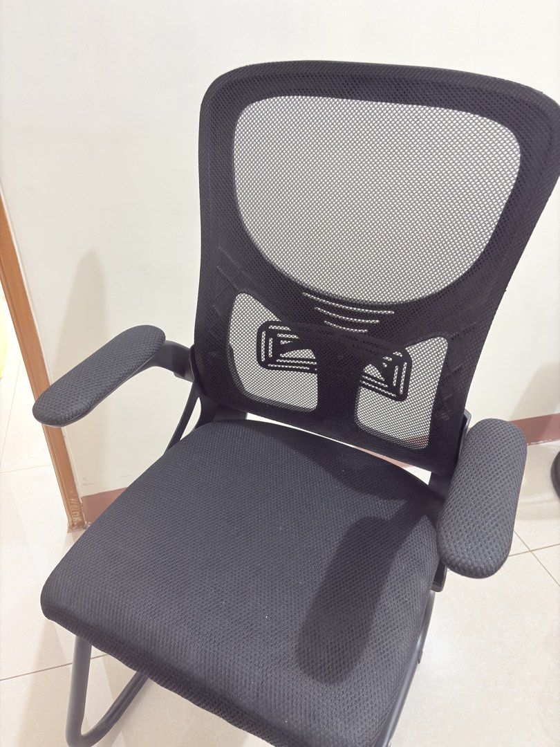 Black Mesh Office Chair with Armrests (Category: Chairs) located in Manila. Submitted by declutterbyshy (Listing ID 1438475080, Image 2). Description: - Breathable mesh back for comfort - Padded seat - Includes armrests - Sturdy frame - Ideal for home or office - Suitable for long hours of work or study.
