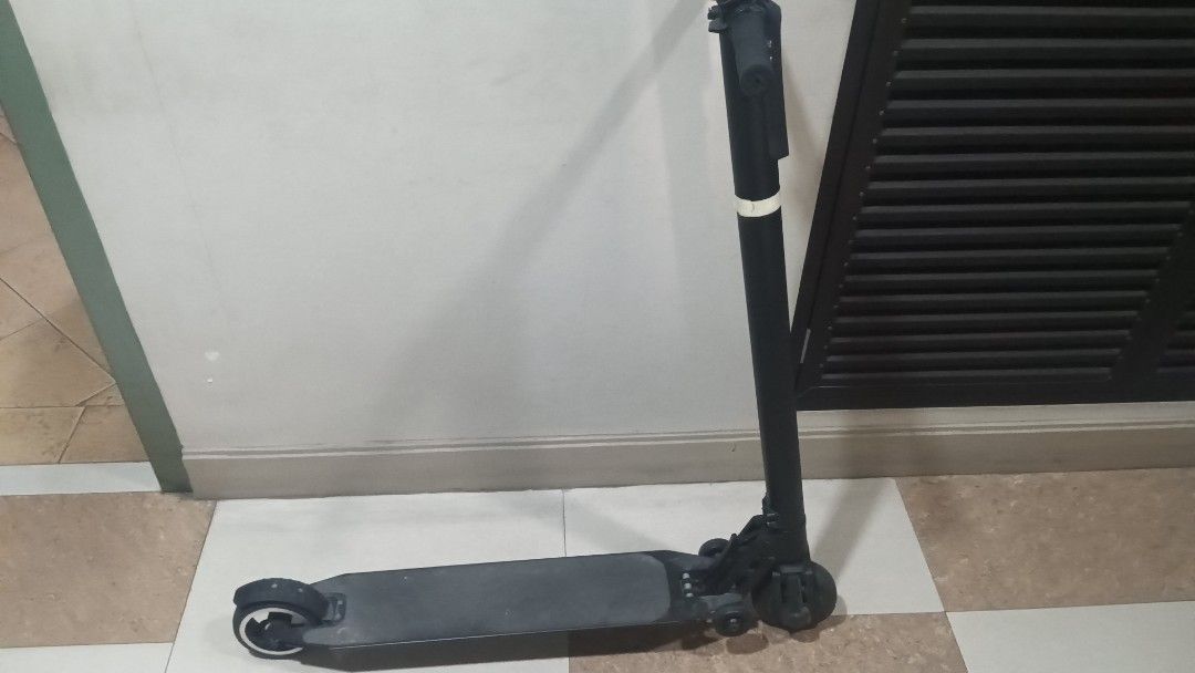 Black Scooter (Category: Skates, Rollerblades & Scooters) located in Manila. Submitted by kchingx (Listing ID 1438365320, Image 1). Description: - Black foldable scooter - Black wheels with white accents - Perfect for commuting or recreation electric with charger. newly replaced batteries..