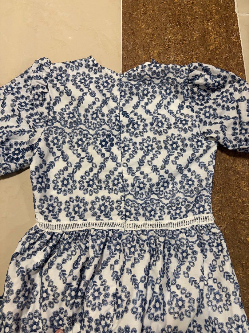 Blue and white Midi Dress (Category: Dresses) located in Manila. Submitted by same.skin (Listing ID 1438461995, Image 2). Description: - White midi dress - Blue embroidery detail - V-neckline - Short sleeves - Flared skirt - Delicate lace trim - Back zipper closure - Suitable for casual and special occasions.