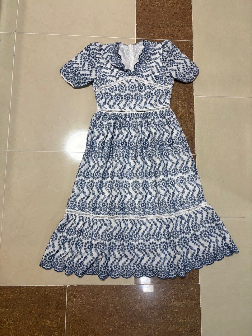 Blue and white Midi Dress (Category: Dresses) located in Manila. Submitted by same.skin (Listing ID 1438461995, Image 1). Description: - White midi dress - Blue embroidery detail - V-neckline - Short sleeves - Flared skirt - Delicate lace trim - Back zipper closure - Suitable for casual and special occasions.
