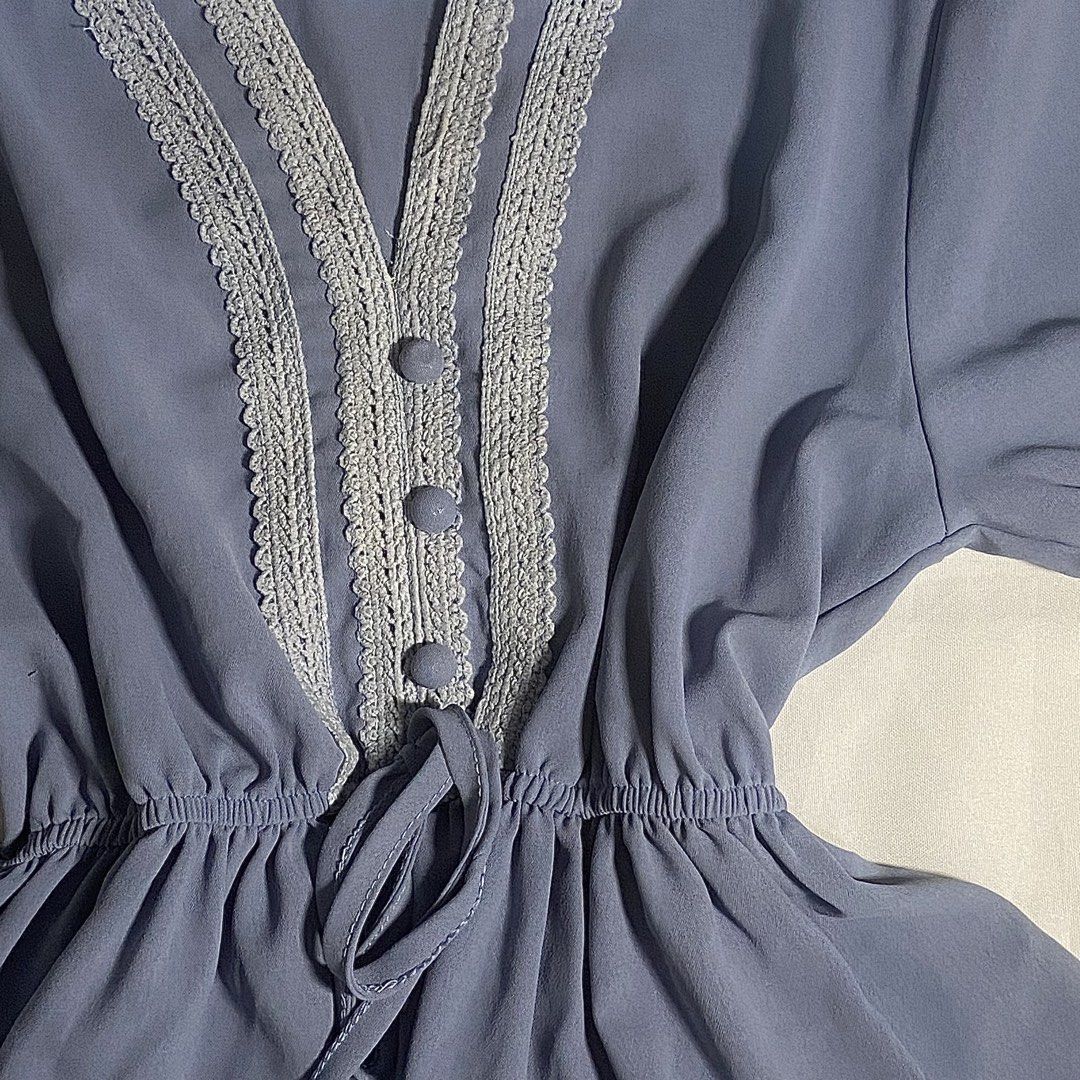 Blue V-Neck Blouse with Lace Trim (Category: Blouses) located in Tarlac. Submitted by glam1x_ (Listing ID 1438458545, Image 2). Description: - Blue V-neck blouse - Delicate lace trim - Short, ruffled sleeves - Cinched waist with drawstring - Three front buttons - Lightweight and flowy fabric.