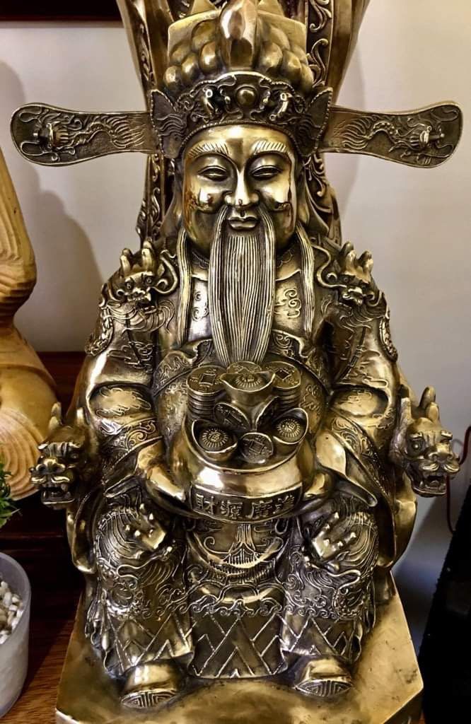 Brass God of Wealth Statue (Category: Other Home Decor) located in Cavite. Submitted by esp777 (Listing ID 1438450779, Image 1). Description: - Exquisite brass statue of the God of Wealth. - Features intricate details: long beard, ornate headdress, and coins. - Seated figure holding a pot of coins. - Perfect decorative piece for good fortune and prosperity. - No to SWAP Price: 30,000.