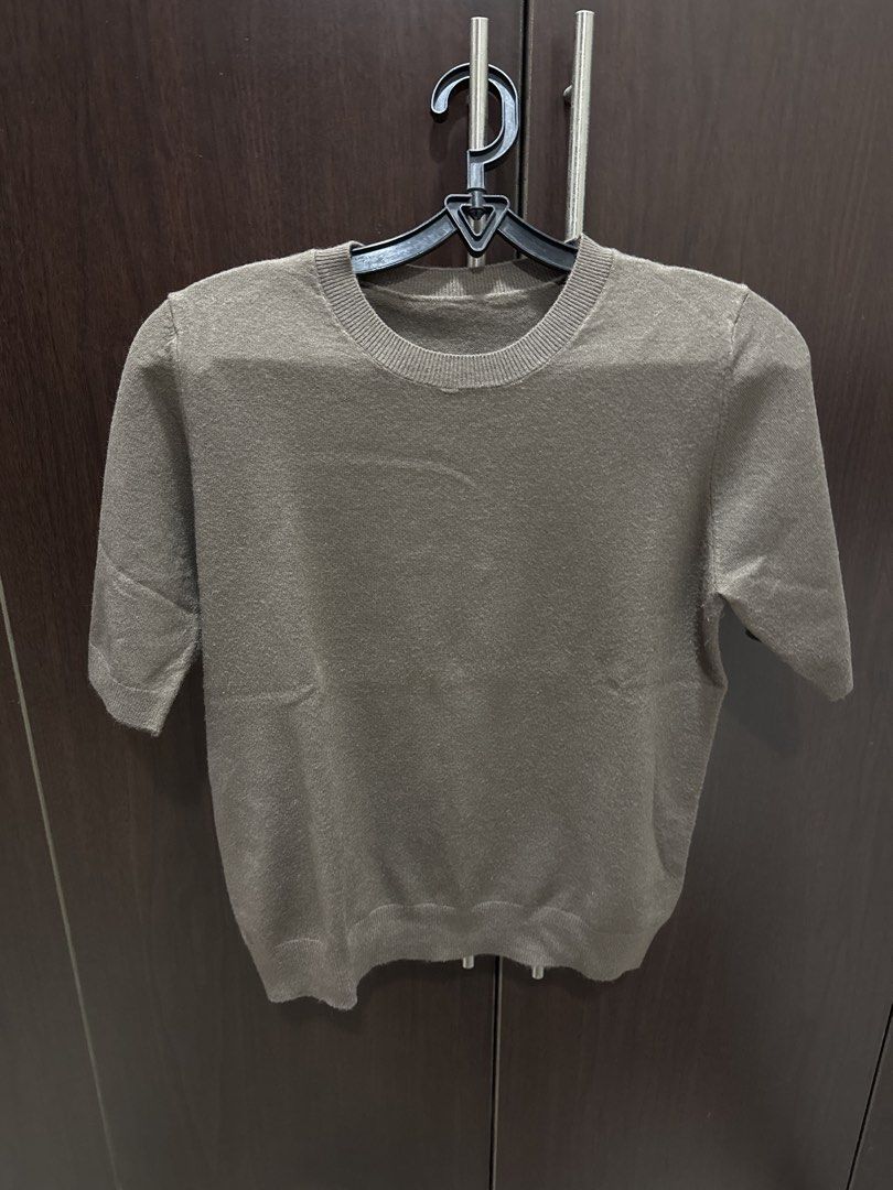 Brown Short Sleeve Top (Category: Blouses) located in Quezon City. Submitted by vsaint (Listing ID 1438419461, Image 1). Description: - Brown short-sleeved top - Round neckline - Made of knit material - Simple design - Suitable for various occasions.