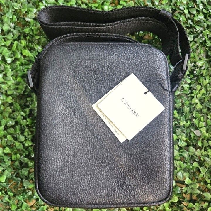 Calvin Klein Black Crossbody Bag (Category: Sling Bags) located in Imus. Submitted by mostlyvintage (Listing ID 1438387431, Image 2). Description: 🎀 Calvin Klein crossbody/sling bag 🎀 🎀 made of durable black leather 🎀 🎀 features a main compartment for essentials 🎀 🎀 adjustable shoulder strap for a comfortable fit 🎀 🎀 iconic Calvin Klein logo on the front 🎀 🎀 includes original tags 🎀 🎀 perfect for everyday use 🎀 🌸 for fashion finds 