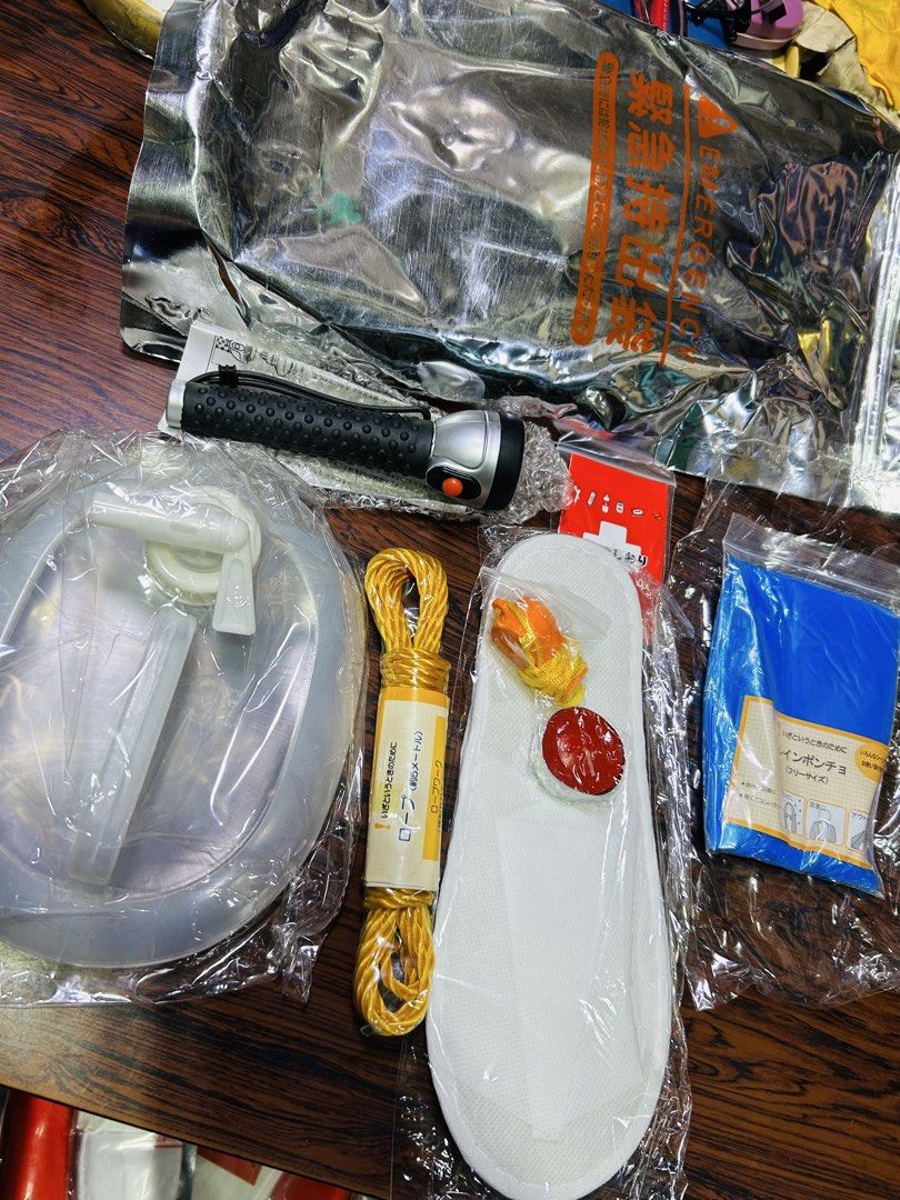 Camping Emergency Kit with Flashlight (Category: Medical Supplies & Tools) located in Manila. Submitted by starbalesukandjapansurplus (Listing ID 1438386086, Image 3). Description: - Emergency preparedness kit. - Includes: water bag, flashlight, rope, poncho, and other vital supplies. - Packaged in a silver bag. - Features a convenient handle for easy carrying. - Ideal for unexpected situations..