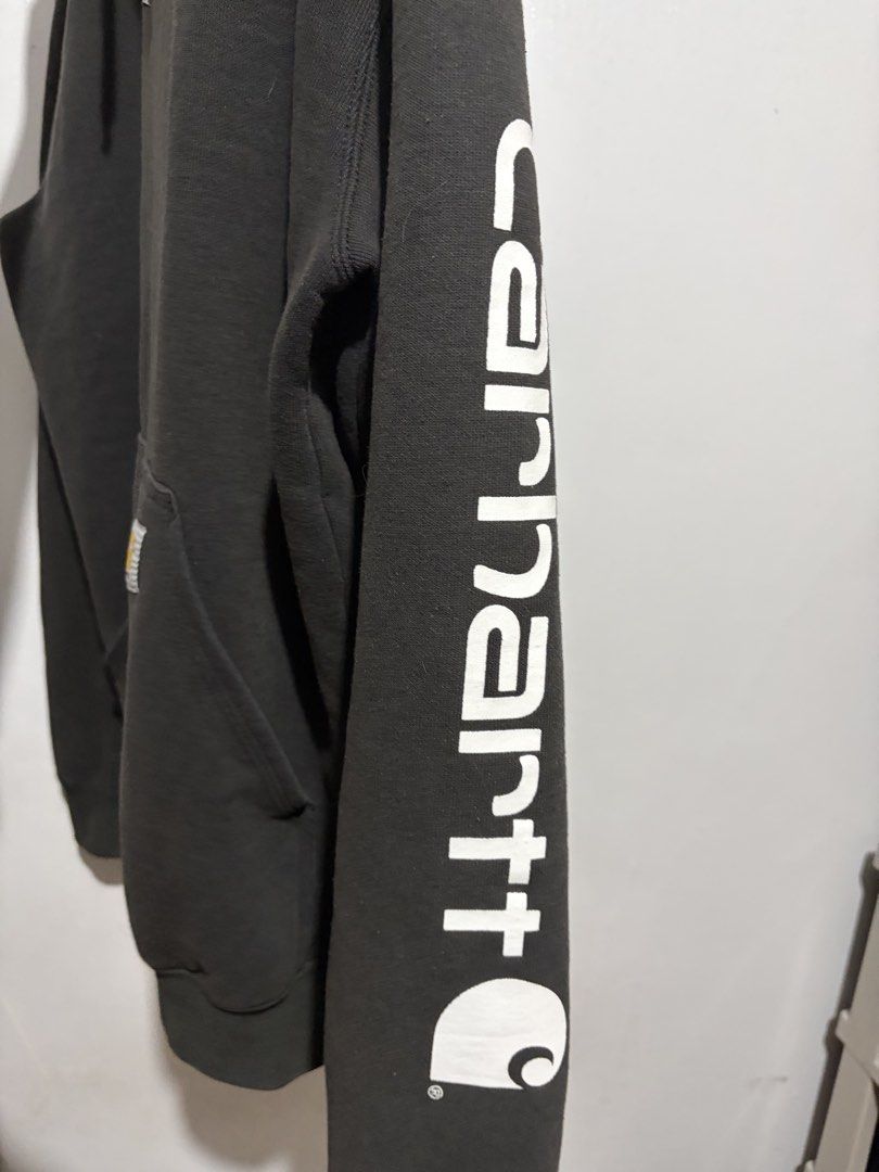Carhartt Hoodie - Small (Category: Hoodies) located in Angeles City. Submitted by declutter.pamp (Listing ID 1438407860, Image 3). Description: - Carhartt hoodie - Color: Dark Grey - Size: Small - Features: Kangaroo pocket, Carhartt logo on front and sleeve - Made in Honduras.