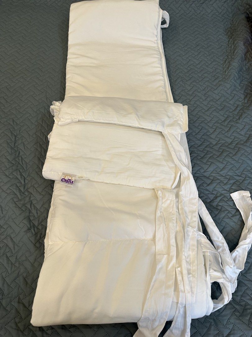 Castle for Baby Crib Bumper (Category: Cots & Cribs) located in Quezon City. Submitted by things2things (Listing ID 1438314853, Image 2). Description: - White crib bumper from Castle for Baby - Made of 100% cotton - Features ties for secure attachment - Clean and well-maintained condition - Creates a soft and safe space for your baby.