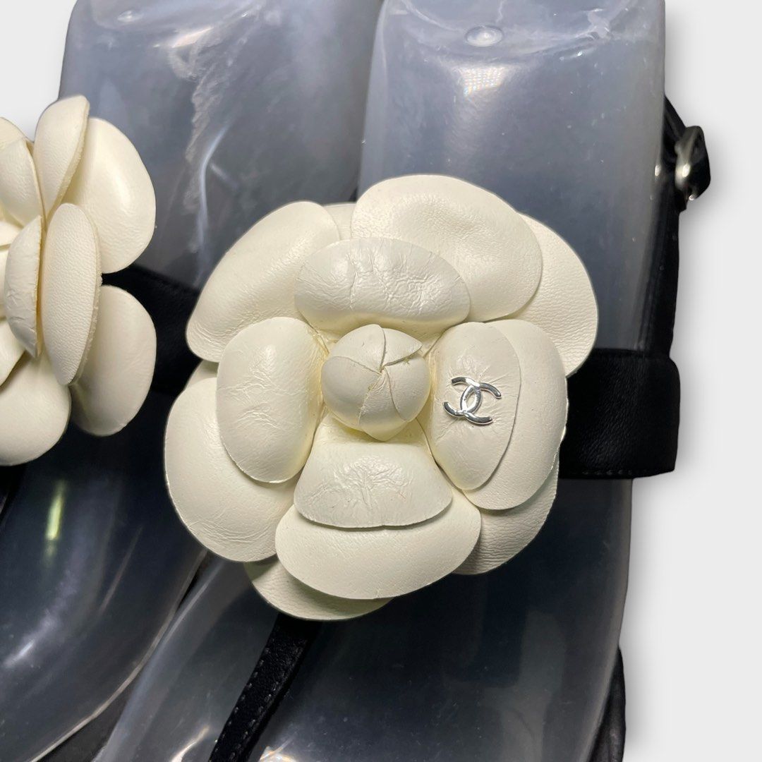 Chanel - Camellia CC Flat Leather Sandals (Category: Flats & Sandals) located in Los Banos. Submitted by declutterking (Listing ID 1438489336, Image 3). Description: Size 38C This summer, give an edge to your outfit by stepping out in these thong sandals from the house of Chanel. Crafted from black leather, this pair features a t-strap and buckle fastening at the ankle. The pair is complete with a CC-adorned Camellia flower on the front. Pair onl