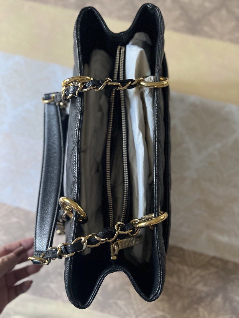 Chanel GST Caviar Tote Bag (Category: Luxury Bags & Wallets) located in Santa Rosa. Submitted by steffies_closet (Listing ID 1438461136, Image 3). Description: - Authentic Chanel tote bag - Black caviar leather - Quilted design with CC logo - Gold-tone chain straps and top handle - Includes dust bag and authenticity card - Multiple interior compartments.