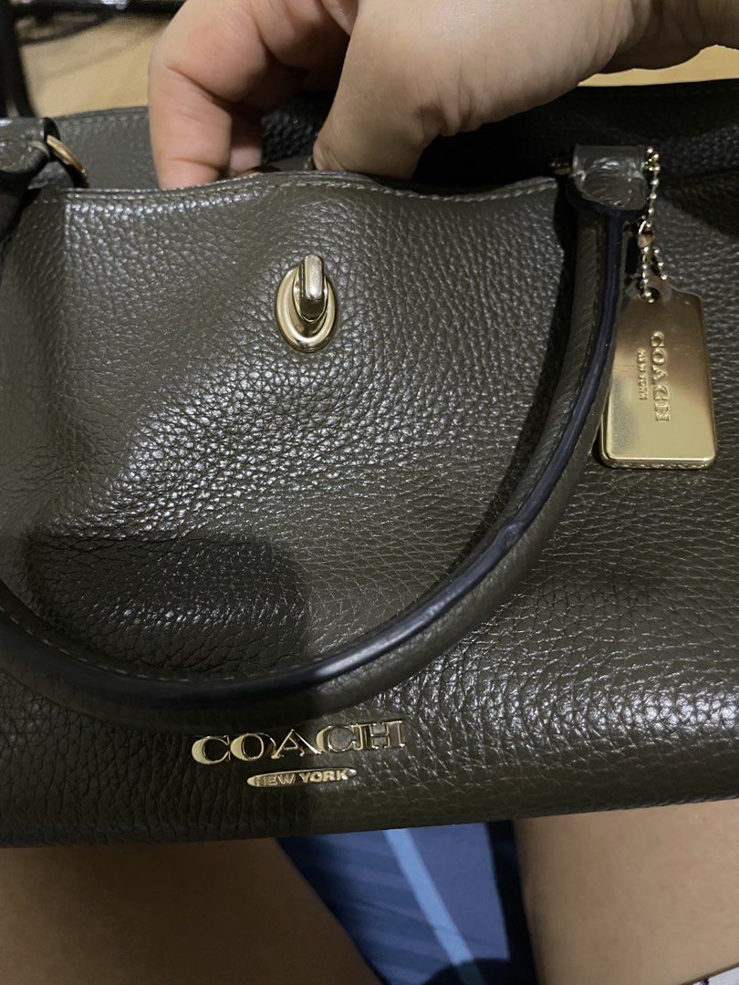 Coach Shoulder Bag (Category: Luxury Bags & Wallets) located in Manila. Submitted by mars1122334455 (Listing ID 1438066535, Image 2). Description: - self authenticate - this is used so pls manage expectations -Coach shoulder bag in dark green - Top handle and detachable shoulder strap - Includes gold-tone Coach tag - Flap closure with turn lock - Made of textured leather - Suitable for everyday use and special events.