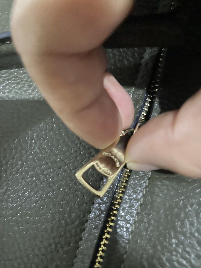 Coach Shoulder Bag (Category: Luxury Bags & Wallets) located in Manila. Submitted by mars1122334455 (Listing ID 1438066535, Image 3). Description: - self authenticate - this is used so pls manage expectations -Coach shoulder bag in dark green - Top handle and detachable shoulder strap - Includes gold-tone Coach tag - Flap closure with turn lock - Made of textured leather - Suitable for everyday use and special events.