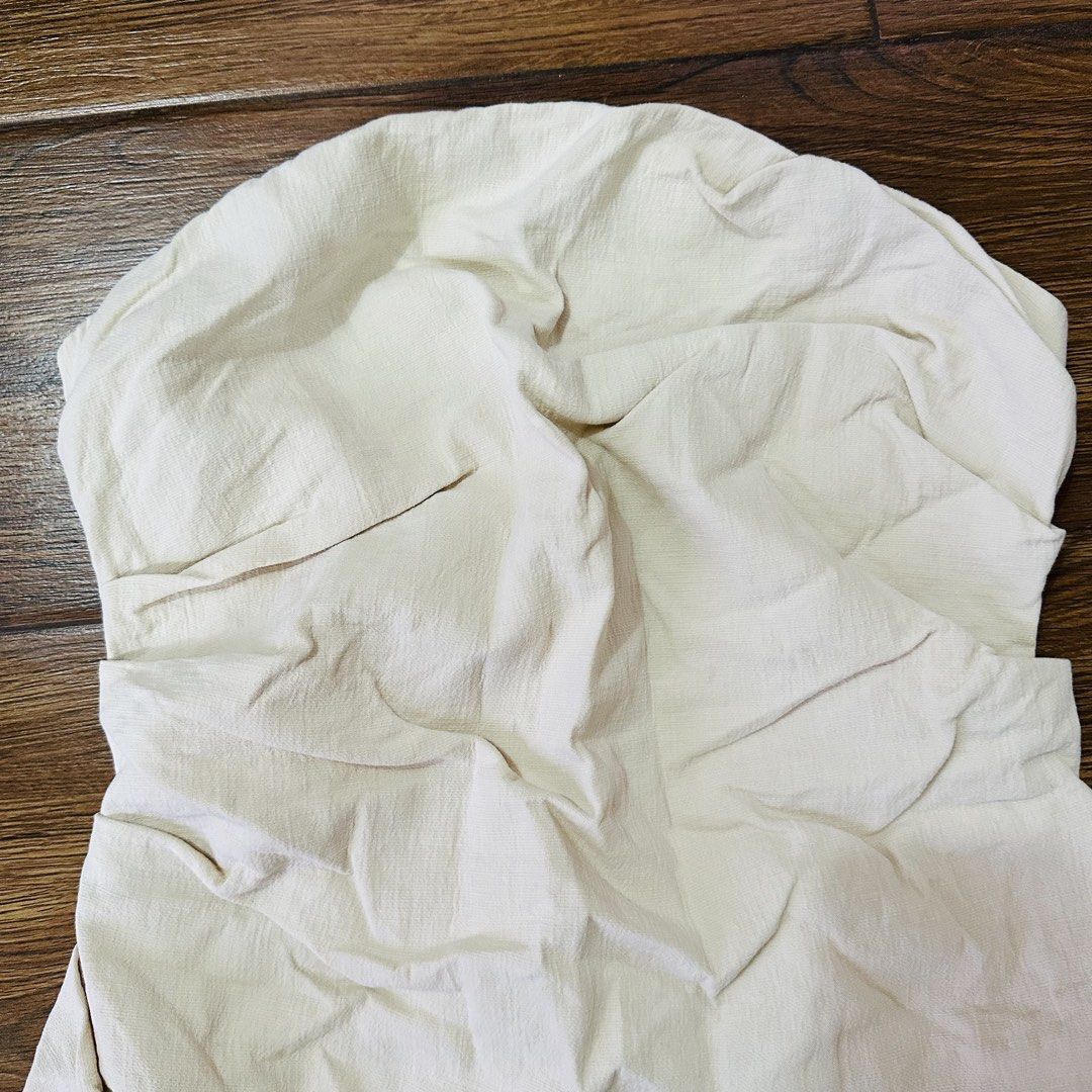 Zara Cream Strapless Dress - Size M (Category: Dresses) located in Dolores. Submitted by harleyquinn819 (Listing ID 1438361722, Image 3). Description: - Last price - Cream-colored strapless dress - Ruched bodice - Straight, fitted skirt - Zipper closure at the back - Lightweight fabric - Suitable for warmer weather - Simple, elegant design.