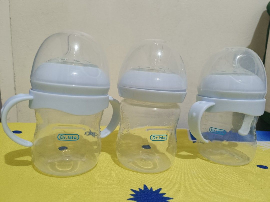 Dr. Isla Baby Bottles with Handles - TAKE ALL (Category: Breastfeeding & Bottle Feeding) located in Meycauayan. Submitted by cottonville (Listing ID 1438463689, Image 1). Description: - Set of three Dr. Isla baby bottles 5oz - Two bottles with handles - One bottle with sippy cup spout - Clear plastic bodies with blue accents - Designed for easy gripping - Ideal for transitioning to independent drinking.