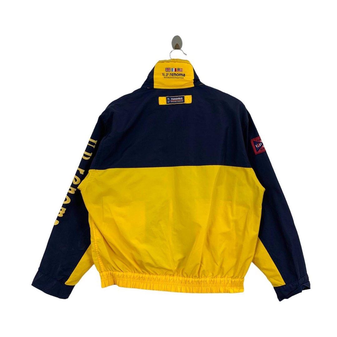 Ed Renoma Color Block Jacket (Category: Coats, Jackets and Outerwear) located in Manila. Submitted by skullvucool (Listing ID 1438340342, Image 2). Description: - UP Renoma color block jacket - Navy blue and yellow design - High collar - Front zipper - Multiple pockets - Brand logo on sleeves and chest - Interior lining with brand logo - Ribbed hem and cuffs.