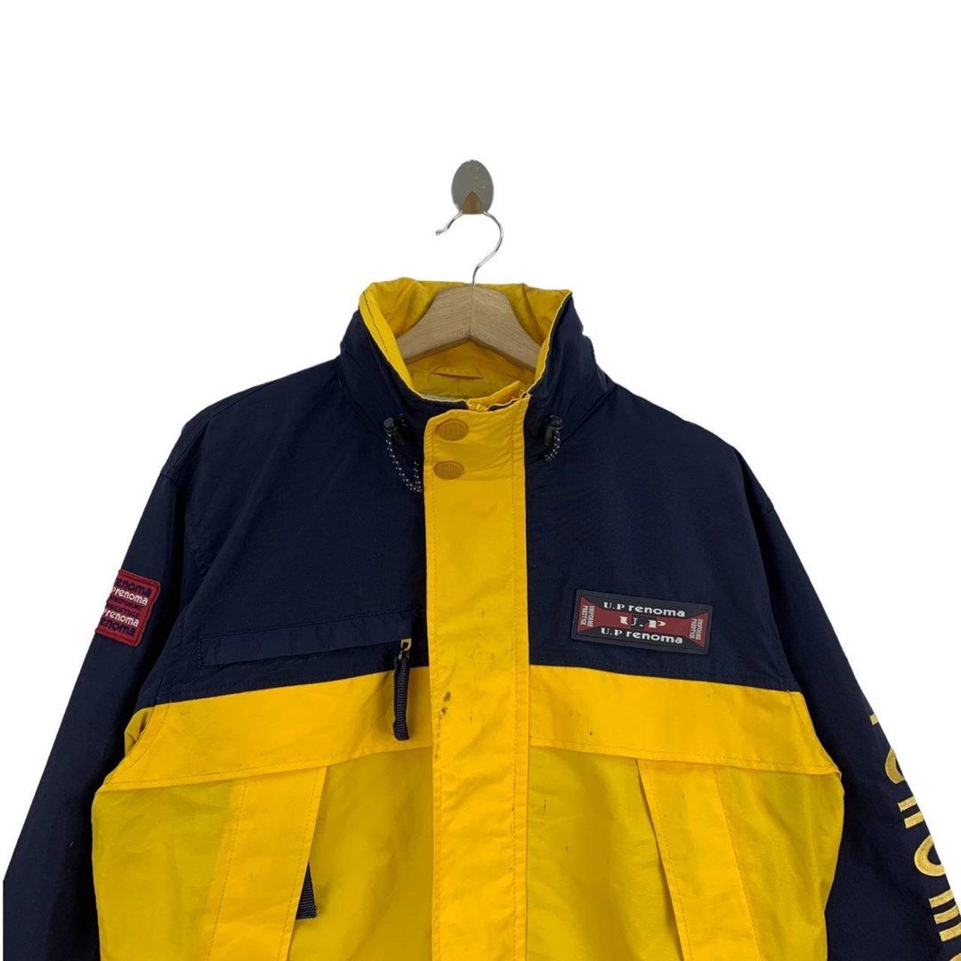 Ed Renoma Color Block Jacket (Category: Coats, Jackets and Outerwear) located in Manila. Submitted by skullvucool (Listing ID 1438340342, Image 3). Description: - UP Renoma color block jacket - Navy blue and yellow design - High collar - Front zipper - Multiple pockets - Brand logo on sleeves and chest - Interior lining with brand logo - Ribbed hem and cuffs.