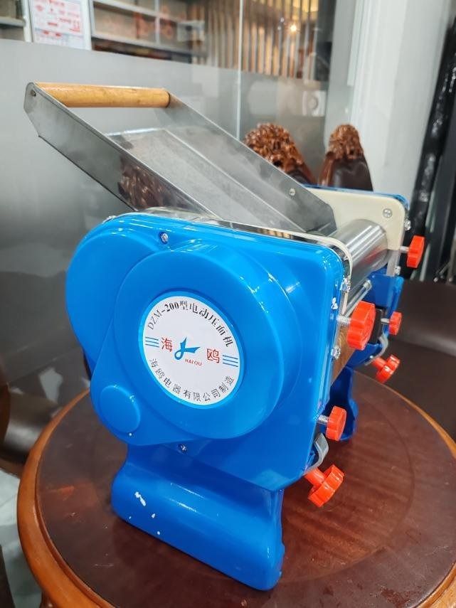Electric Noodle Maker DZM 200 (Category: Other Kitchen Appliances) located in Taguig. Submitted by minimaliscent (Listing ID 1438319402, Image 1). Description: - Electric noodle maker, model DZM-200 Product Details : Heavy Duty Electric Noodle Cutter Dough Roller DZM-200 PRICE : 5799 Lifetime service/labor warranty, parts NOT included. Dito sa amin gagawin ang unit, hindi kami nag oonsite service. Kahit 10 years na po ang units sa inyo if ever ma