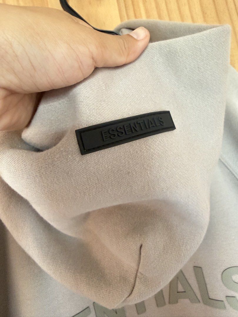 Essential Hoodie (Category: Activewear) located in Batangas. Submitted by safefinds (Listing ID 1438356705, Image 3). Description: Small on tag runs big loose fit color: gray gifted not sure of authenticity worn 2x like new.