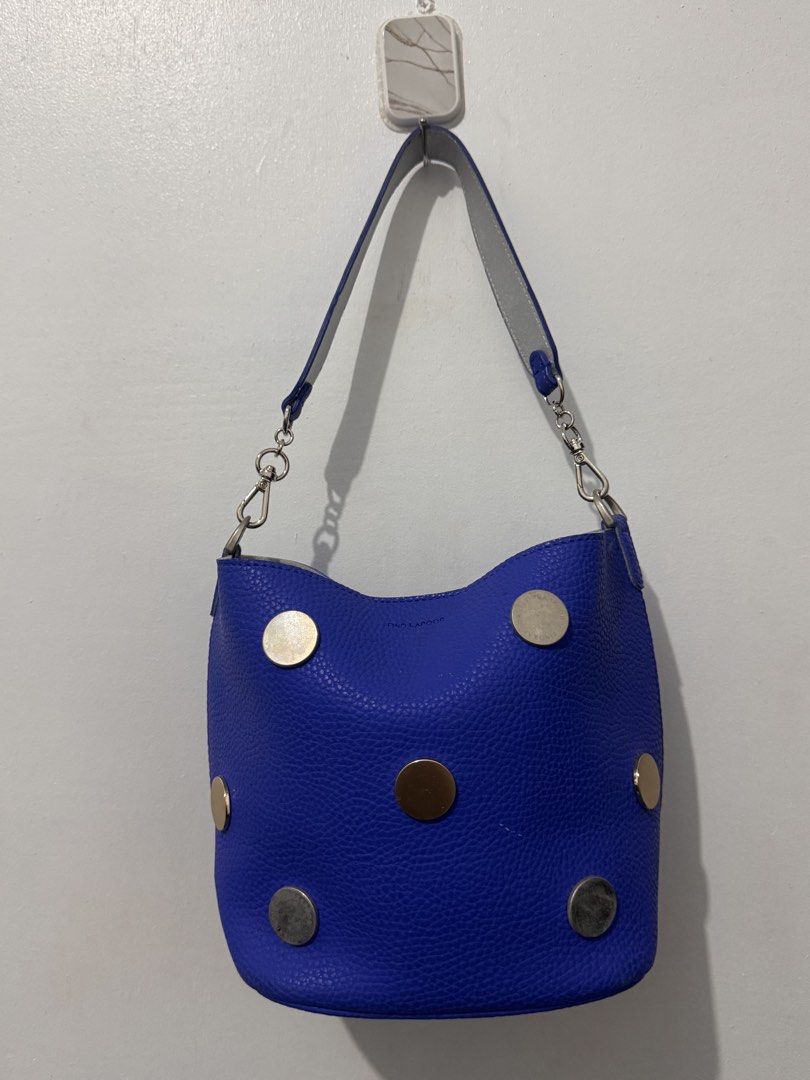 Find Kapoor Blue Bucket Bag (Category: Shoulder Bags) located in Manila. Submitted by yaelita (Listing ID 1438433412, Image 1). Description: - Find Kapoor bucket bag - Vibrant blue exterior - Metallic accents - Shoulder strap with silver chain - Light-colored interior - Structured shape - Textured finish - Brand name visible on hardware and interior label.
