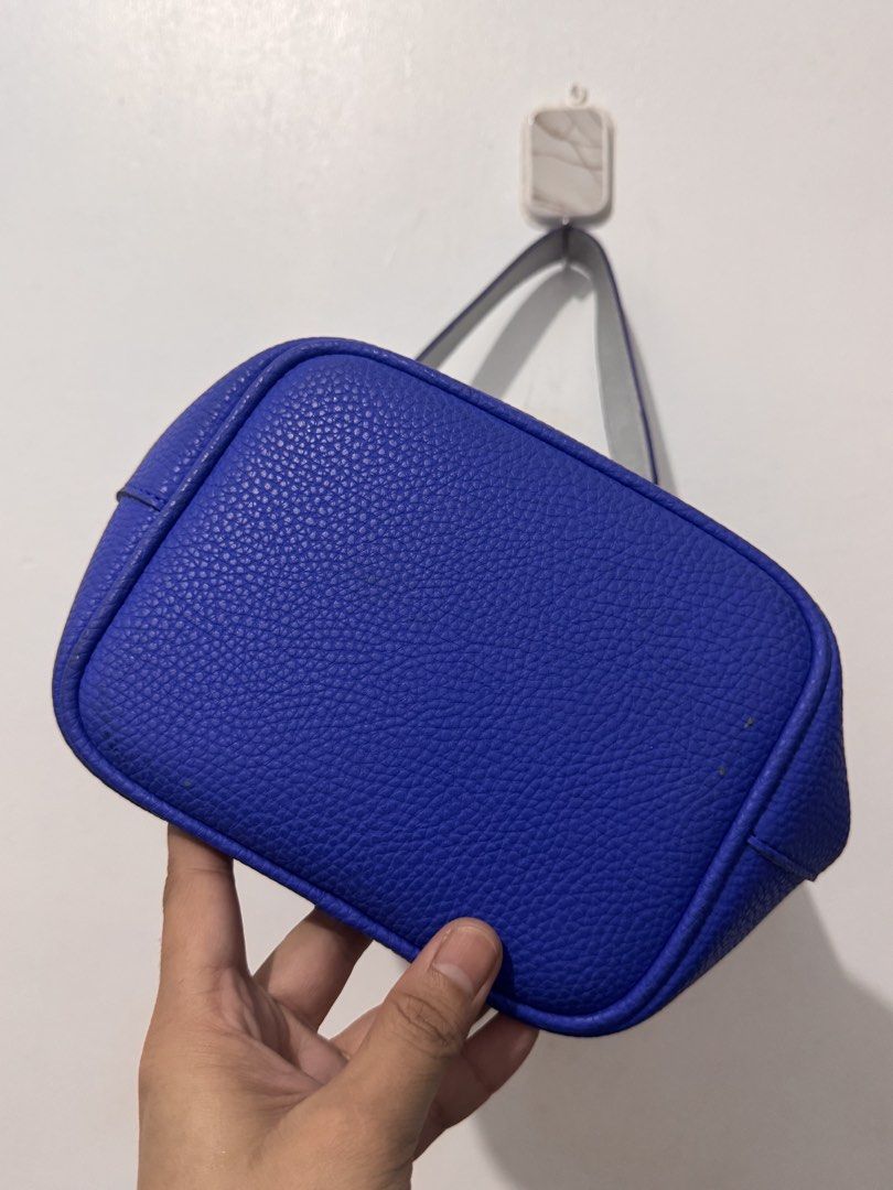 Find Kapoor Blue Bucket Bag (Category: Shoulder Bags) located in Manila. Submitted by yaelita (Listing ID 1438433412, Image 2). Description: - Find Kapoor bucket bag - Vibrant blue exterior - Metallic accents - Shoulder strap with silver chain - Light-colored interior - Structured shape - Textured finish - Brand name visible on hardware and interior label.