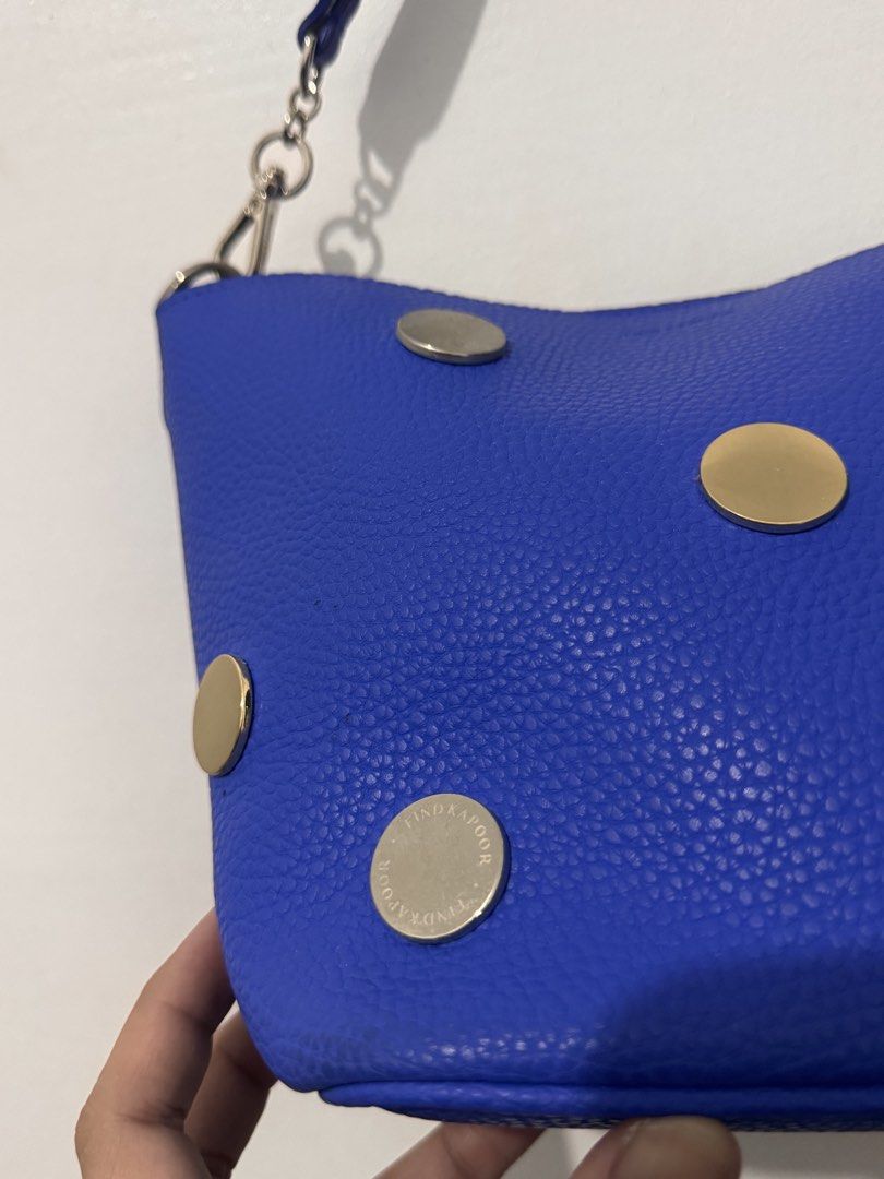 Find Kapoor Blue Bucket Bag (Category: Shoulder Bags) located in Manila. Submitted by yaelita (Listing ID 1438433412, Image 3). Description: - Find Kapoor bucket bag - Vibrant blue exterior - Metallic accents - Shoulder strap with silver chain - Light-colored interior - Structured shape - Textured finish - Brand name visible on hardware and interior label.