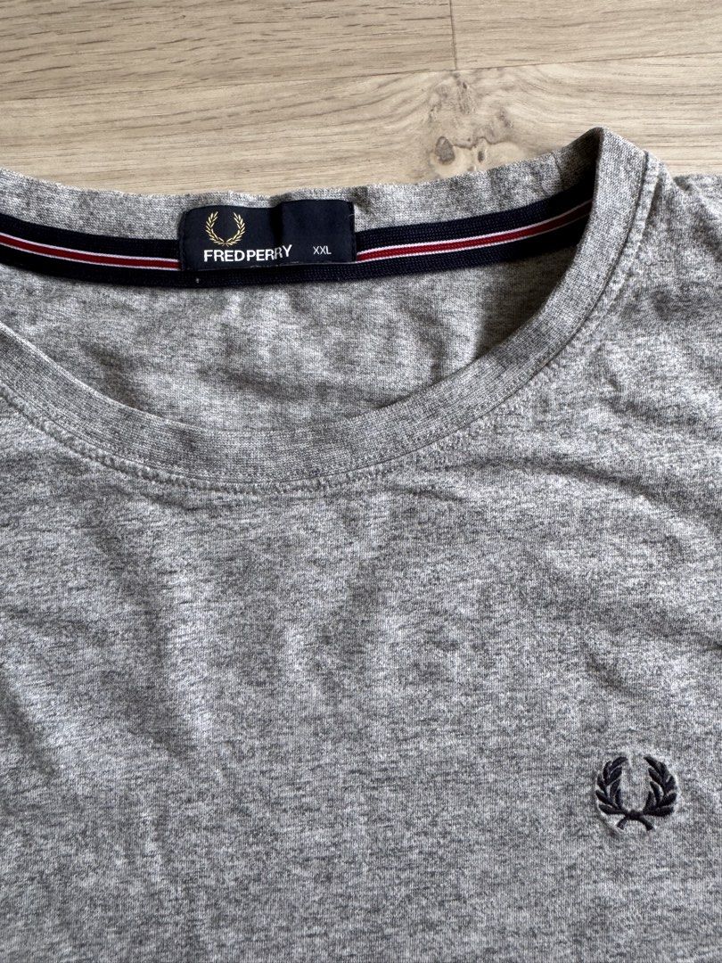 Fred Perry Basic Tee (Category: Tshirts & Polo Shirts) located in Singapore. Submitted by lcenny (Listing ID 1438369706, Image 2). Description: Barely worn Fred Perry round neck tee in marl grey. Mens Size XXL: approx. ptp 60.5cm, length 71cm Condition 9/10 .