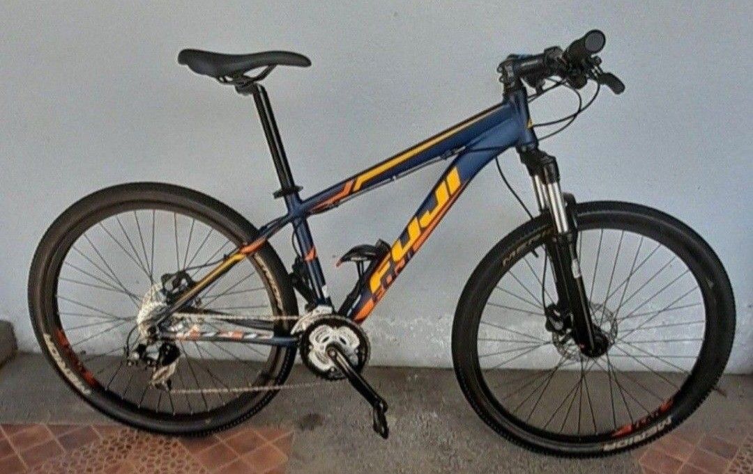 Fuji Nevada Mountain Bike (Category: Bicycles) located in Manila. Submitted by ja_mese (Listing ID 1438360351, Image 1). Description: fs 2016 fuji nevada one.9 -good condition and upgraded -original paint and decals -26er -size small -with bike skin -Rockshox tora sl 318 solo air fork *working lock-out and damper system -carbon fiber flat handle bar on 80mm stem -shimano hydraulic brakes -shimano 3x8 groupset -stock fuji wheelset on 2.1 tires *cl