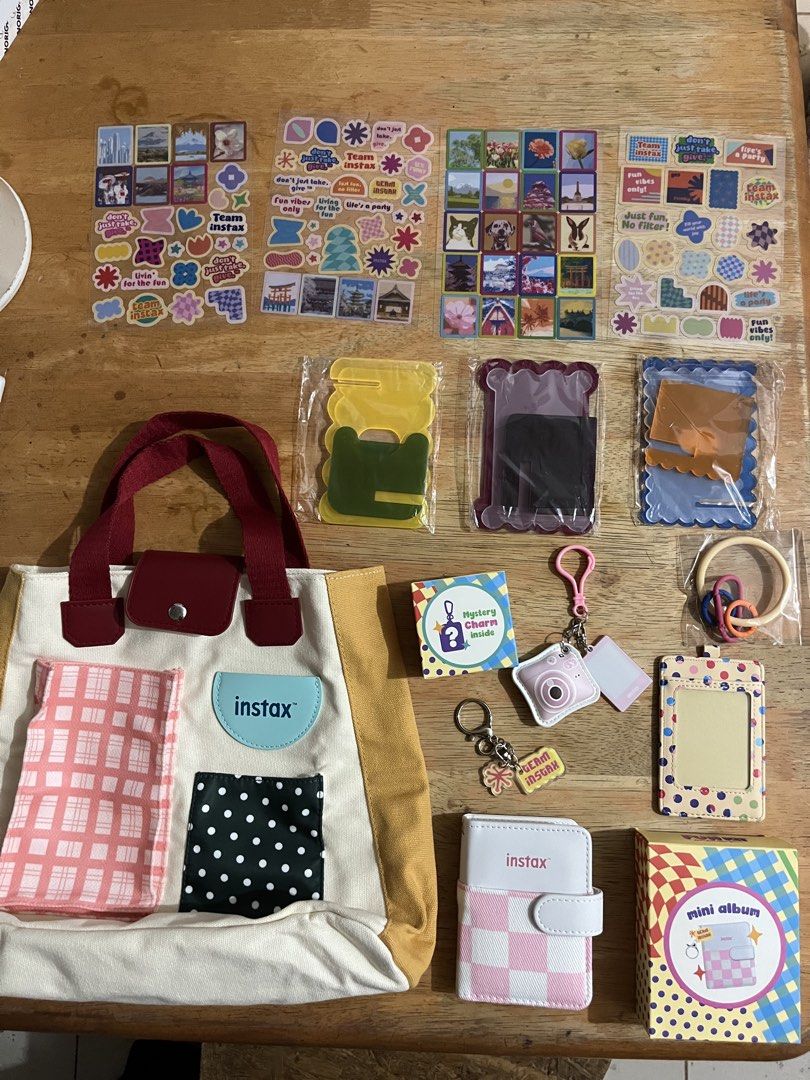 Fujifilm Instax Mini Fun Kit Accessories (Category: Cameras) located in Santa Rosa. Submitted by sarys_saristore (Listing ID 1438398085, Image 1). Description: Instax Mini 13 Fun Kit Accessories - Photo Card Holder - Photobook with Charm - Sticker Set - Colored Frame - Unique Bag with Fabric Patches - Mystery Charm + random freebies from seller ❤️ Also available as per piece for limited stocks only! 🫶🏻.