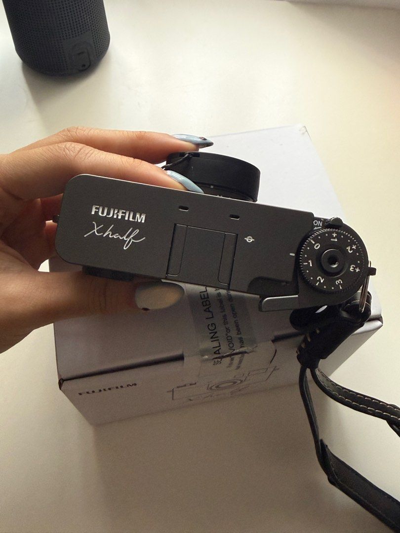 Fujifilm X Half Camera - Complete Accessories (Category: Cameras) located in Paranaque City. Submitted by soycamie (Listing ID 1438363227, Image 2). Description: Selling my Fujifilm X half Purchased last March for ¥92,000. Selling for ₱27,000. LAST PRICE. Local SRP: ₱44,000. Rarely used and still in excellent condition. Super fun compact camera with Fujifilm film simulations, vertical shooting format, and that nostalgic film-camera feel. Perfect 