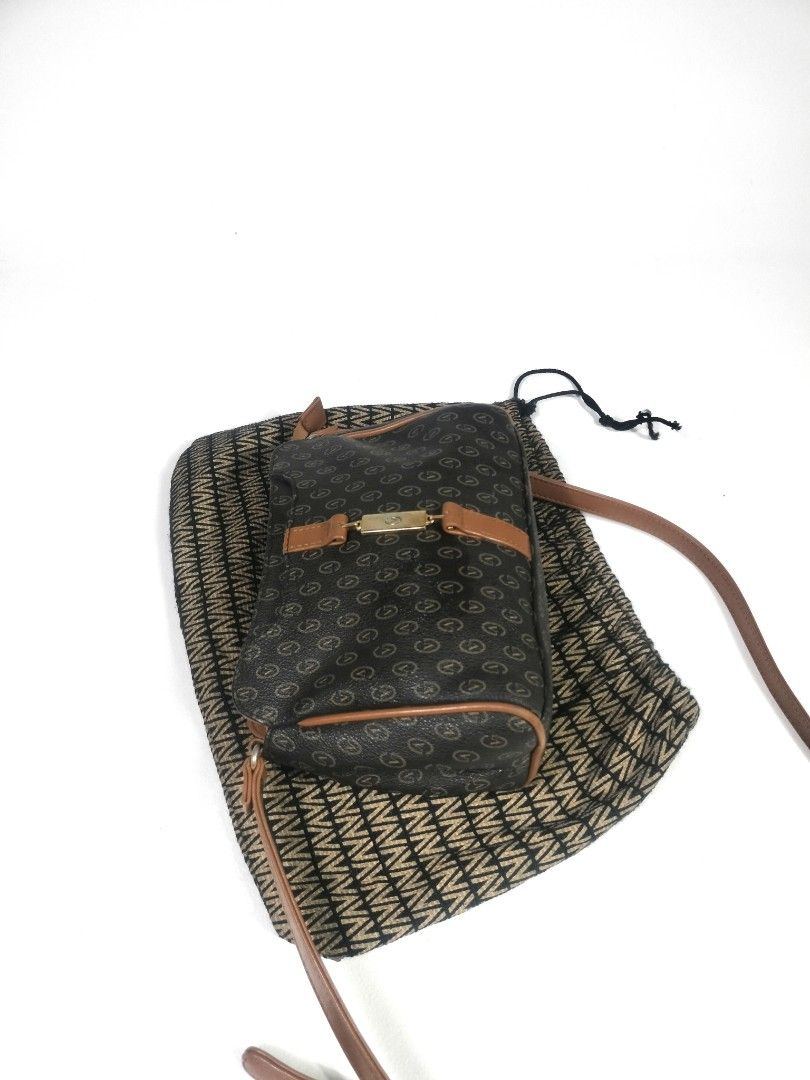 Gianni Valentino Crossbody Bag (Category: Luxury Bags & Wallets) located in Manila. Submitted by callmetin (Listing ID 1438428306, Image 2). Description: - Gianni Valentino crossbody bag - Brown monogram pattern with leather accents - Includes dust bag - Top zipper closure - Adjustable shoulder strap - Lined interior - Gold-tone metal logo detail.
