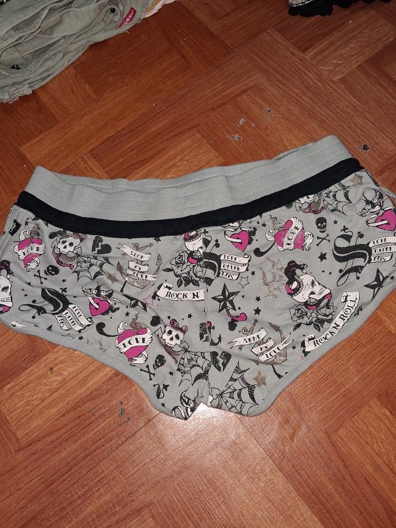 Grey Skull Ed Hardy Vibes shorts (Category: Shorts) located in Manila. Submitted by zafi_ (Listing ID 1438470222, Image 2). Description: - Grey shorts with a unique tattoo-inspired print. - Features a stylish black stripe detail on the side. - Comfortable drawstring for a perfect fit. - Made from soft, cozy material. - Ideal for everyday casual wear..