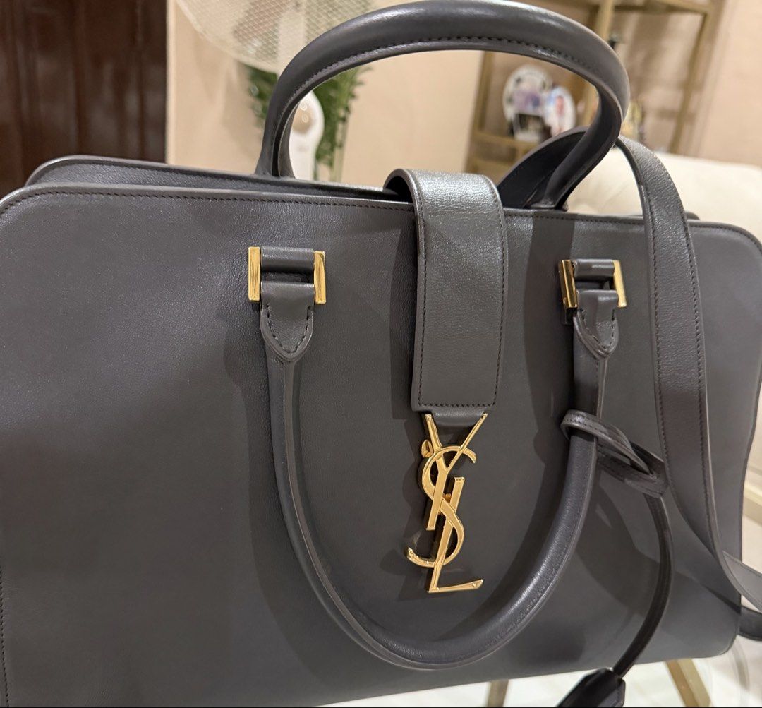 Guaranteed Authentic‼️ YSL Cabas Medium Size (Category: Luxury Bags & Wallets) located in Taguig. Submitted by titaofmanila05 (Listing ID 1438483700, Image 2). Description: Guaranteed Authentic‼️ YSL Cabas Medium Bag Comes with dustbag Comes with strap Medium sized Well loved Normal signs of wear Still structured Minimal tarnish 8/10 condition 3x your money back if proven fake by 3rd party authenticators‼️ RFS: too many bags Still negotiable‼️.