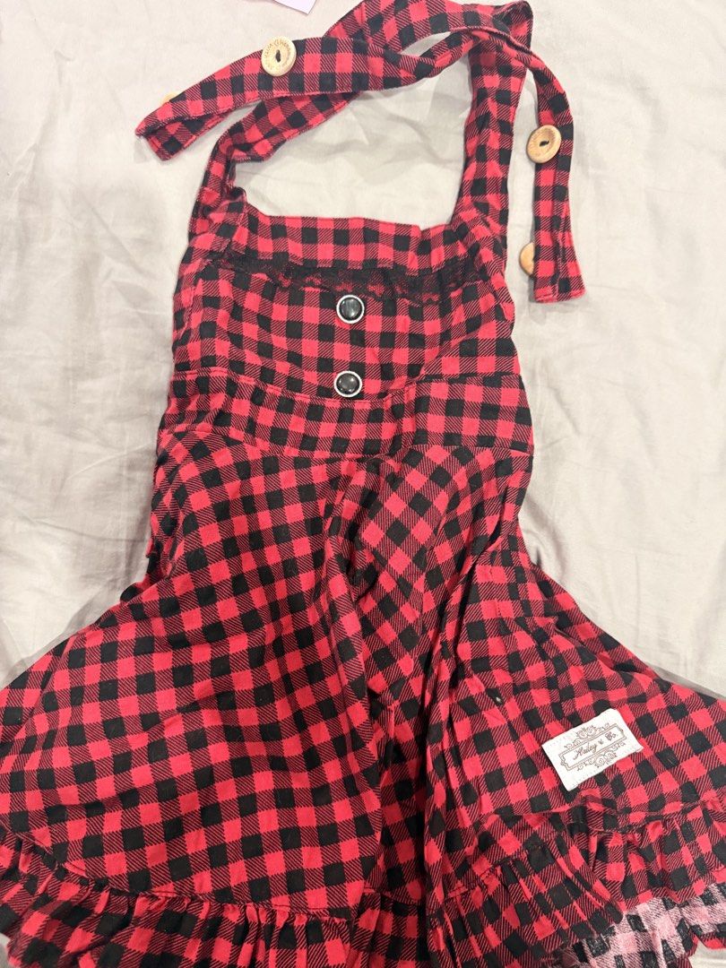 Hailey & Co. Red Plaid Dress (Category: Babies & Kids Fashion) located in Paranaque City. Submitted by mrschuadeclutter (Listing ID 1438440089, Image 1). Description: - Hailey & Co. plaid dress - Red and black color - Halter neck design - Wooden buttons - Ruffled hem - Features two black buttons on bodice - Includes brand tag - Perfect for a casual look Size 2 .