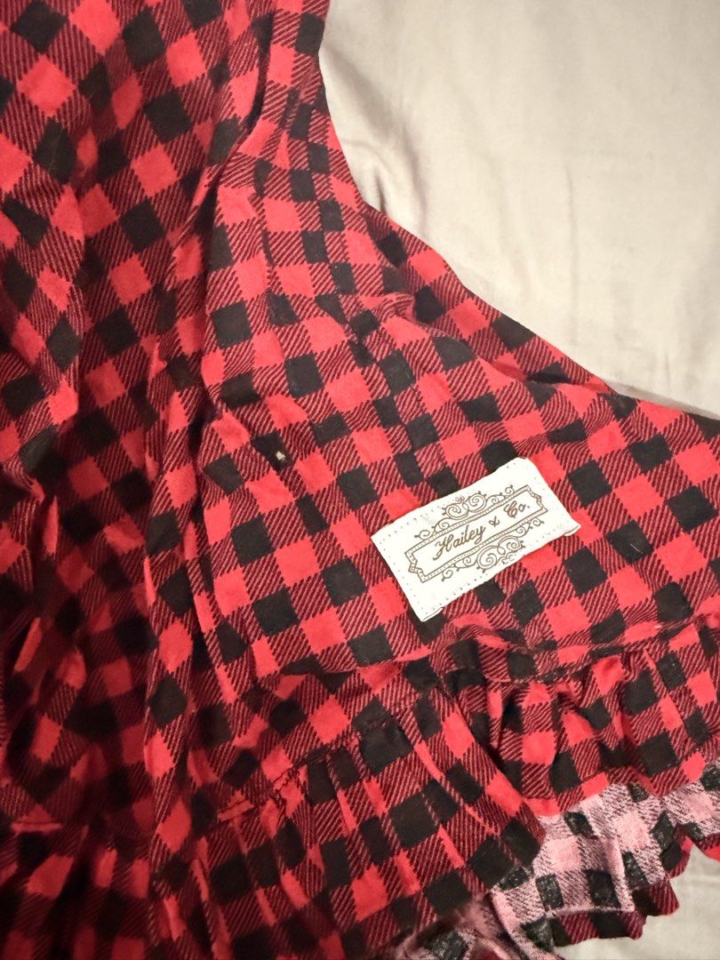 Hailey & Co. Red Plaid Dress (Category: Babies & Kids Fashion) located in Paranaque City. Submitted by mrschuadeclutter (Listing ID 1438440089, Image 2). Description: - Hailey & Co. plaid dress - Red and black color - Halter neck design - Wooden buttons - Ruffled hem - Features two black buttons on bodice - Includes brand tag - Perfect for a casual look Size 2 .