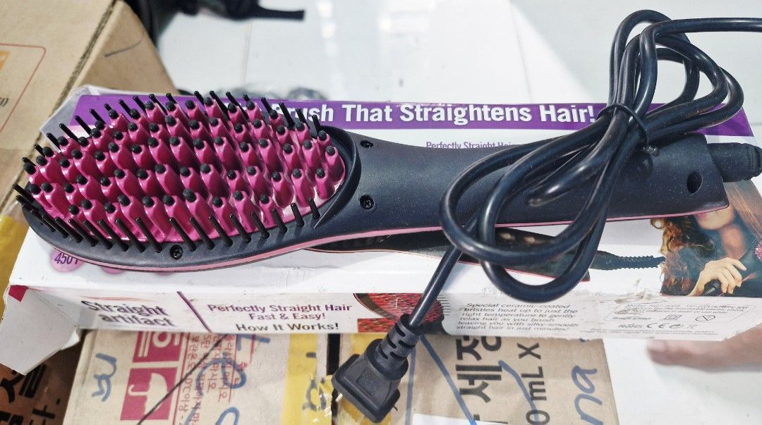 Hair Straightening Brush (Category: Hair) located in Pasay City. Submitted by fortuneflow888 (Listing ID 1438361245, Image 2). Description: For Sale!!! Simply Straight Ceramic Hair Straightening Brush It is an electric heated comb styling tool featuring ceramic-wrapped 3D bristles and a digital LCD temperature display. Price: P350 only + sf.