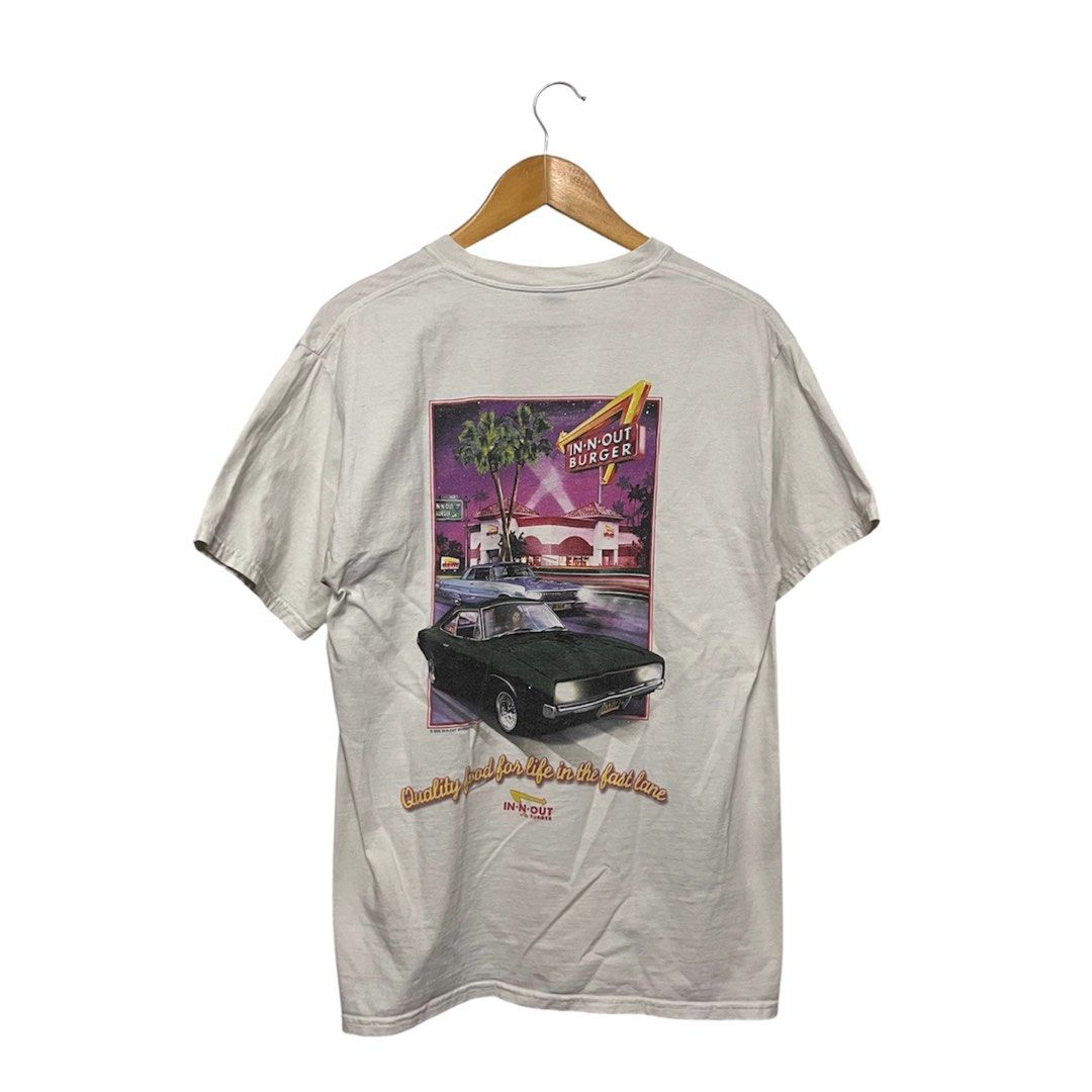 Hanes In-N-Out Burger Graphic Tee (Category: Tshirts & Polo Shirts ) located in Cabuyao City. Submitted by kisyana (Listing ID 1438454728, Image 1). Description: - Vintage In-N-Out Burger t-shirt - Features a graphic on the back with a vintage car and the In-N-Out Burger logo - Smaller In-N-Out Burger logo on the front with "Las Vegas" printed below - "Beefy" style.