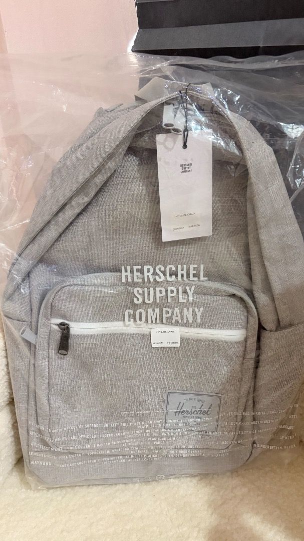Herschel Supply Co. Backpack Pop Quiz (Category: Backpacks) located in Mandaluyong City. Submitted by arian_closet (Listing ID 1438344987, Image 1). Description: - Herschel Supply Co. backpack - Store Price 6,700 - Light grey color - Made from recycled material - Classic backpack design - Adjustable straps - Brand new, still in original packaging.